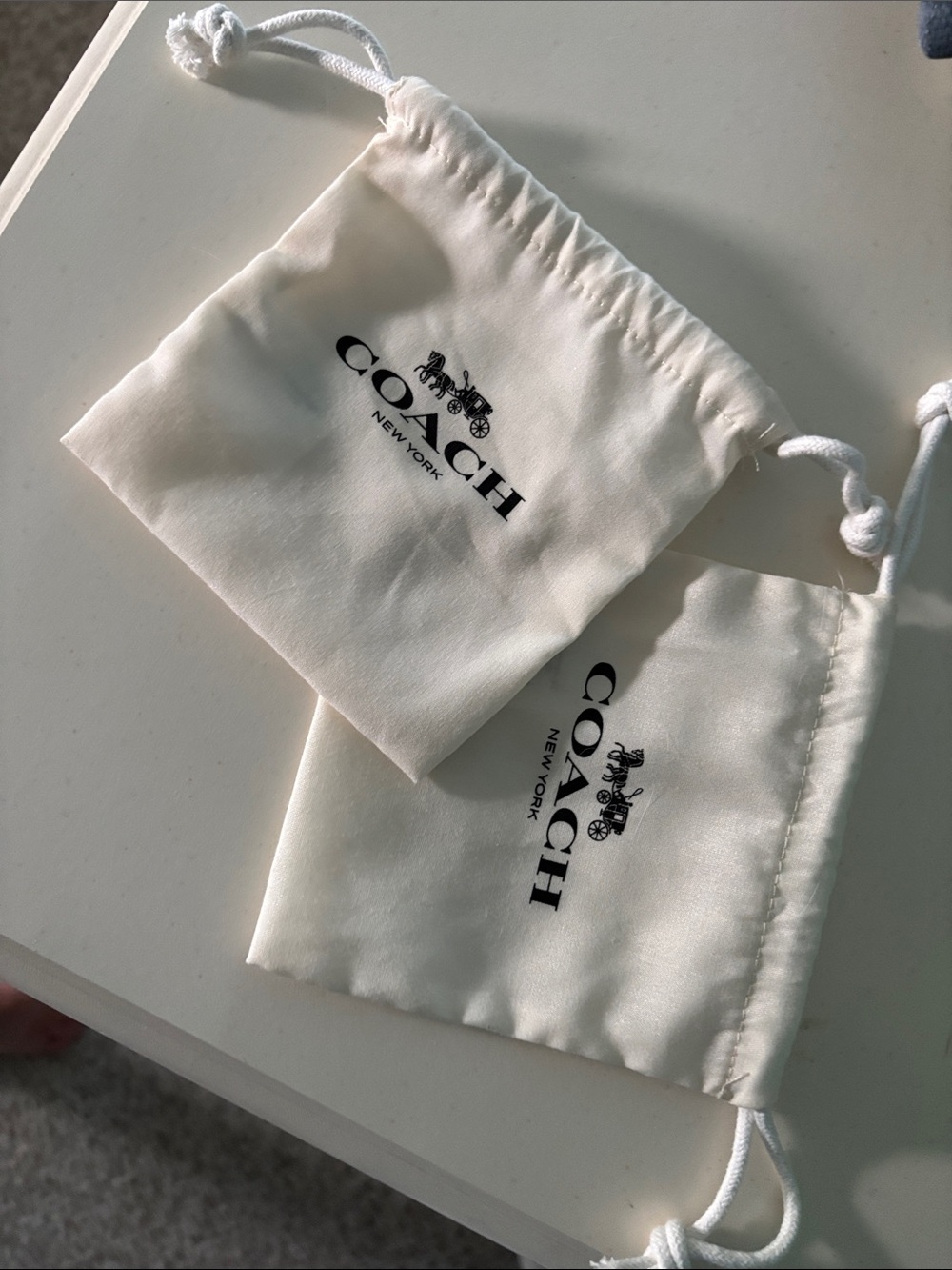 Coach Ivory Drawstring Pouches with Black Logo
